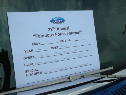 1992 Ford Crown Victoria - A Ford registration document for a 1969 vehicle is displayed on a car's windshield.