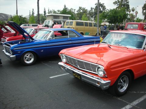 1992 Ford Crown Victoria - Two classic Ford Falcons parked side-by-side at a car show.