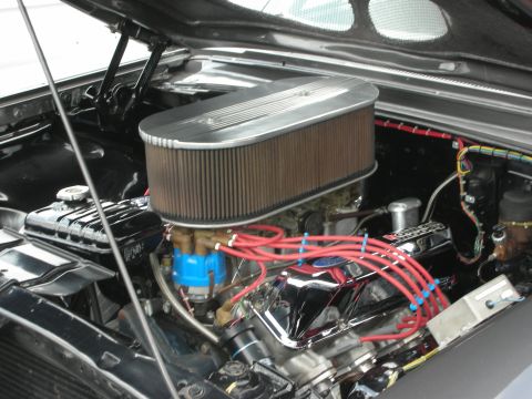 1992 Ford Crown Victoria - Close-up of a modified engine bay chrome valve covers and an aftermarket air filter assembly.