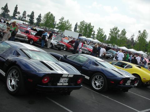 1992 Ford Crown Victoria - A line of Ford GTs are displayed at a car show, with a yellow model visible on the right.