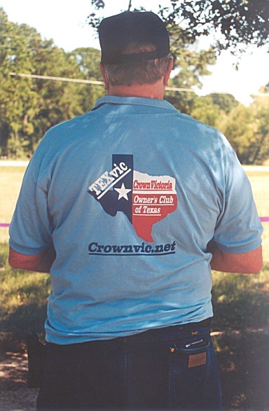2002 Ford Crown Victoria - Man wears a t-shirt advertising the Crown Victoria Owner's Club of Texas.