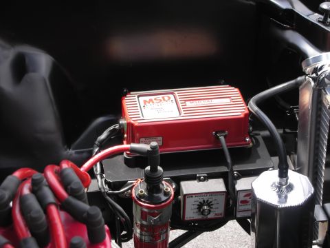 1992 Ford Crown Victoria - Close-up view of an engine bay a red MSD ignition box and distributor, with various wires and components visible.