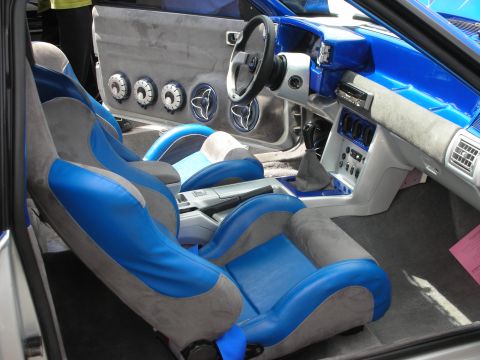 1992 Ford Crown Victoria - Modified interior features custom blue and gray seats and a heavily altered dashboard with multiple speakers.