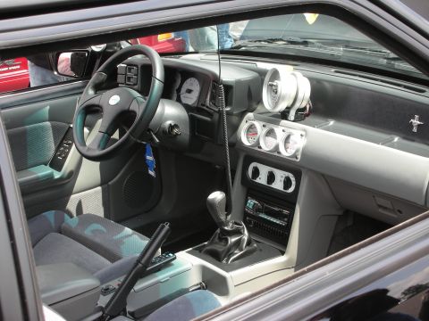 1992 Ford Crown Victoria - The interior of a car is visible, aftermarket gauges and a modified dashboard.