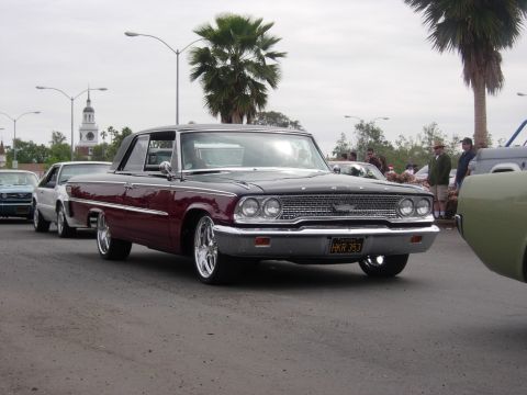 1992 Ford Crown Victoria - A classic 1963 Ford Galaxie 500 is seen from a three-quarter front view at an outdoor car show.