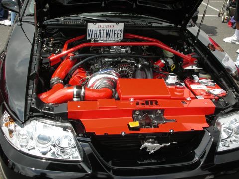 1992 Ford Crown Victoria - Modified engine bay of a Ford Mustang, a prominent turbocharger and custom intake system.