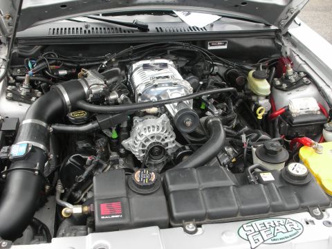 1992 Ford Crown Victoria - Engine bay view a prominent supercharger and Saleen branding, indicating a performance modification.