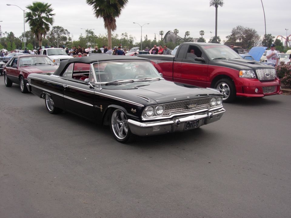 Black 1963 Ford Galaxie convertible with chrome trim and custom wheels