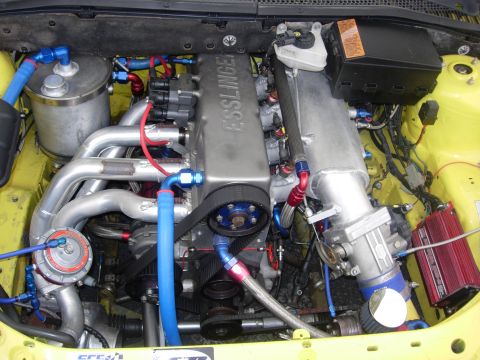 1992 Ford Crown Victoria - Engine bay with custom modifications including an Esslinger valve cover and turbo setup.