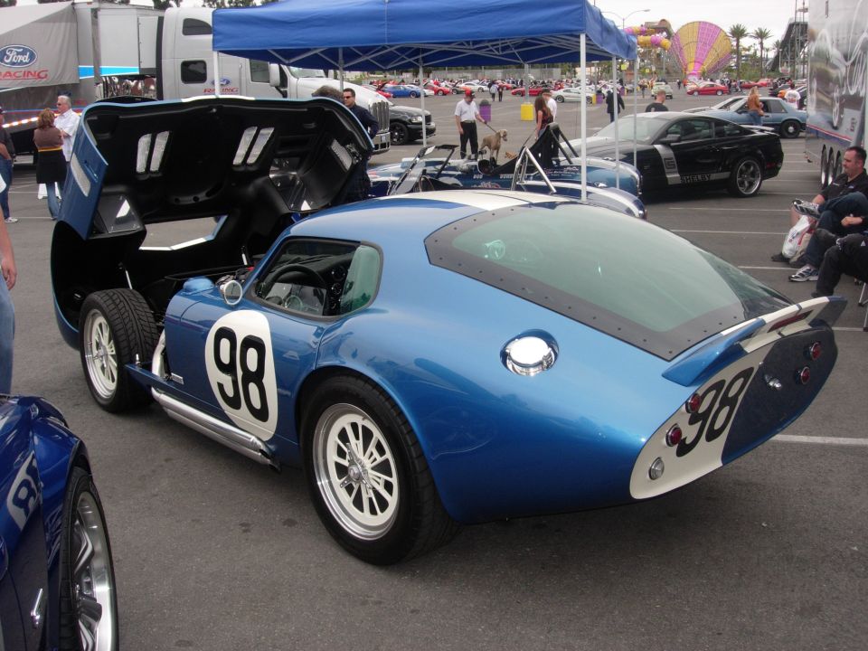 Blue Shelby Cobra Daytona Coupe with white racing stripes and number 98 on door and rear