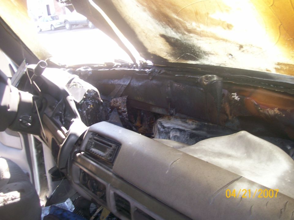 burnt car interior, dashboard and passenger side melted