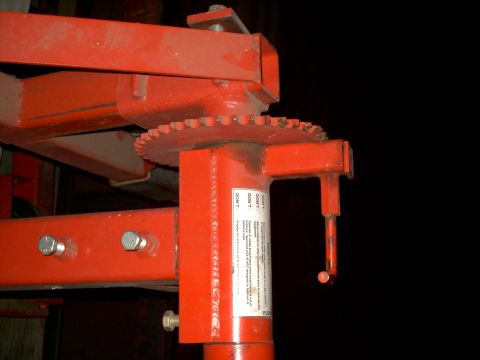 1965 Ford Mustang - A red metal jack stand with a toothed gear and a warning label is visible.