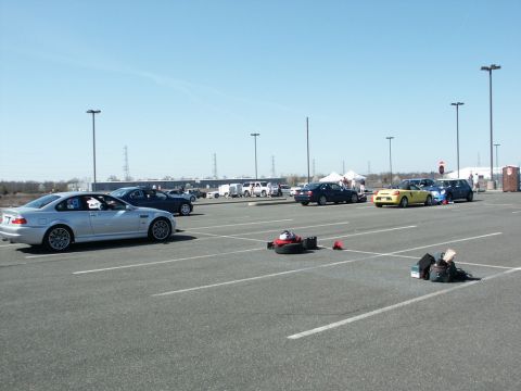 2001 Mercury Grand Marquis - Cars are parked in a lot, possibly for an event, with a blue BMW and yellow convertible visible.