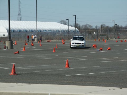 2001 Mercury Grand Marquis - A white BMW E30 M3 navigates an autocross course marked by orange cones.