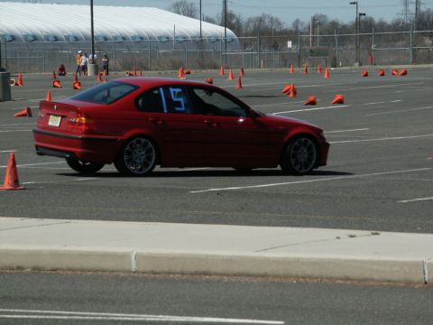 2001 Mercury Grand Marquis - A red sedan with the number 15 on its window navigates a course marked by orange cones.