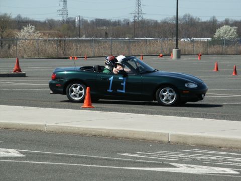 2001 Mercury Grand Marquis - A convertible with racing numbers navigates a course marked by orange traffic cones.