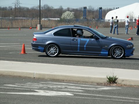 2001 Mercury Grand Marquis - A blue coupe with racing tape and the number 17 is seen on a track with orange cones.