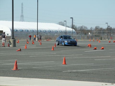 2001 Mercury Grand Marquis - A blue BMW 3 Series coupe is seen on a cone course, likely at an autocross event.
