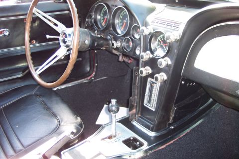 2001 Ford Crown Victoria - The interior of a 1963 Chevrolet Corvette shows its classic dashboard and steering wheel.