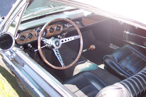 2001 Ford Crown Victoria - Interior view of a classic Ford Mustang, its vintage dashboard and seating.