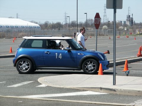 2001 Mercury Grand Marquis - A blue Mini Cooper with a white roof and the number 14 on its door is seen at an autocross event.