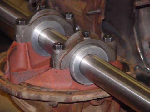 1979 Ford Bronco - Differential housing with axle shafts and bearing caps, likely part of a vehicle's drivetrain.