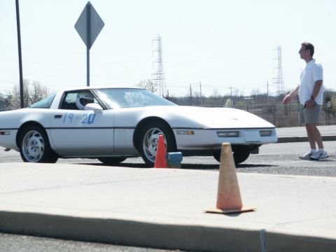 2001 Mercury Grand Marquis - Chevrolet Corvette C4 with racing numbers at an event, possibly an autocross or track day.