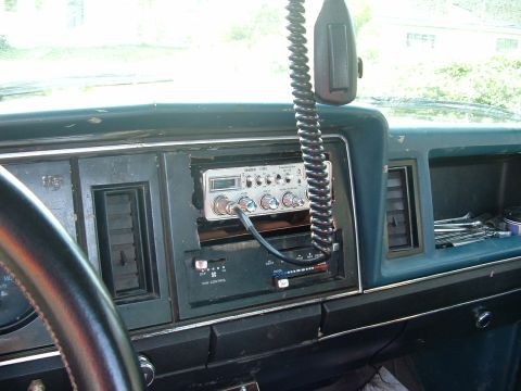 1983 Ford Ranger - The interior of a 1983 Ford Ranger shows a CB radio mounted in the dashboard with a fan control panel beneath it.