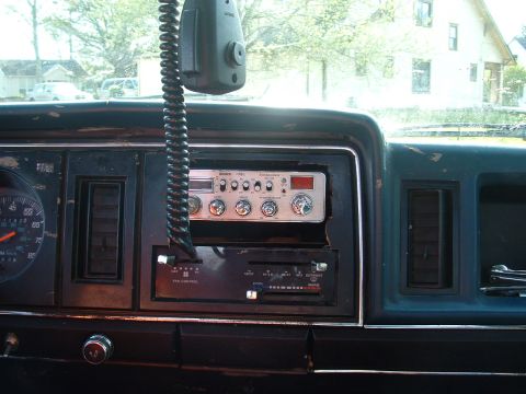 1983 Ford Ranger - Interior view of a vehicle's dashboard, a CB radio and climate controls.