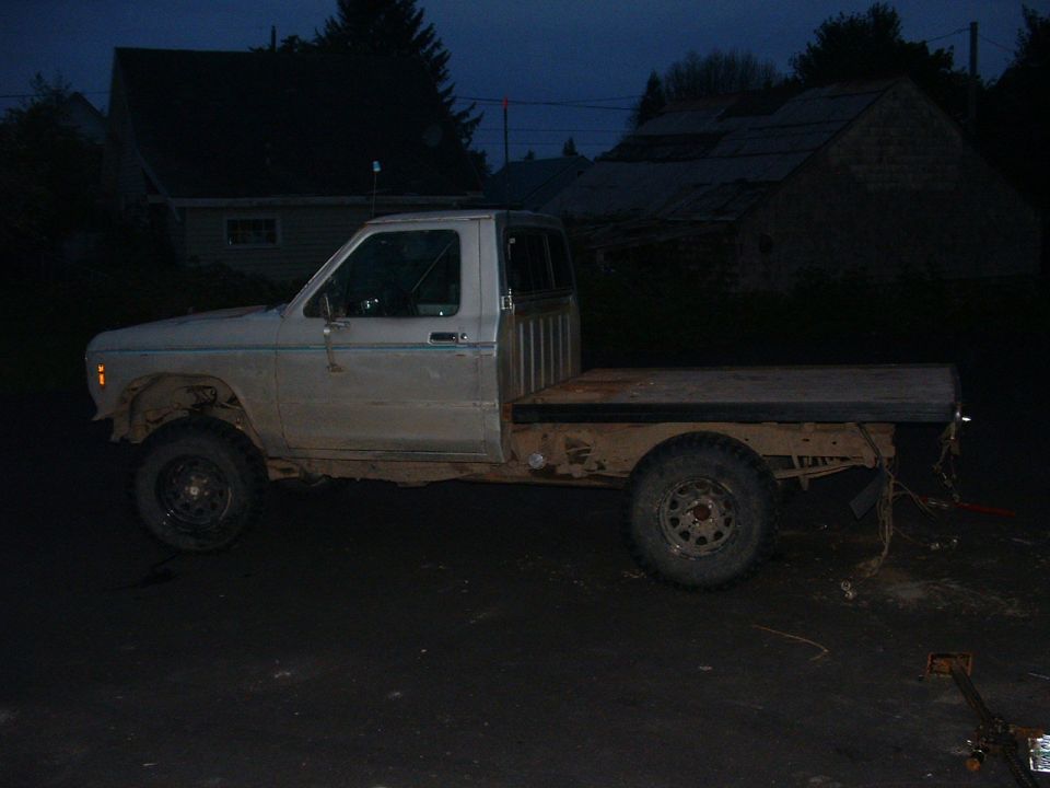 Side view of a white 1983 Ford Ranger flatbed truck