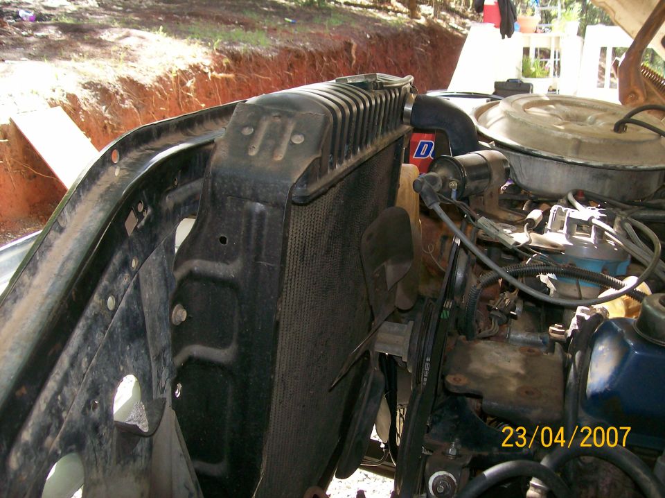 Engine bay showing radiator, fan, and engine components