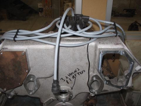 1964 Ford 427 - Close-up of an engine block showing spark plug wires and a distributor cap, with handwritten markings.