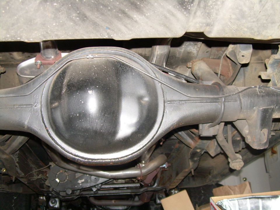 Underside view of a rear axle housing and differential with exhaust pipes