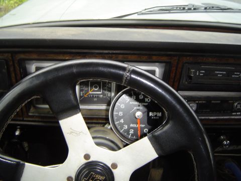 1978 Ford Bronco - Interior view of a 1978 Ford Bronco, showing the dashboard, steering wheel, and gauges.