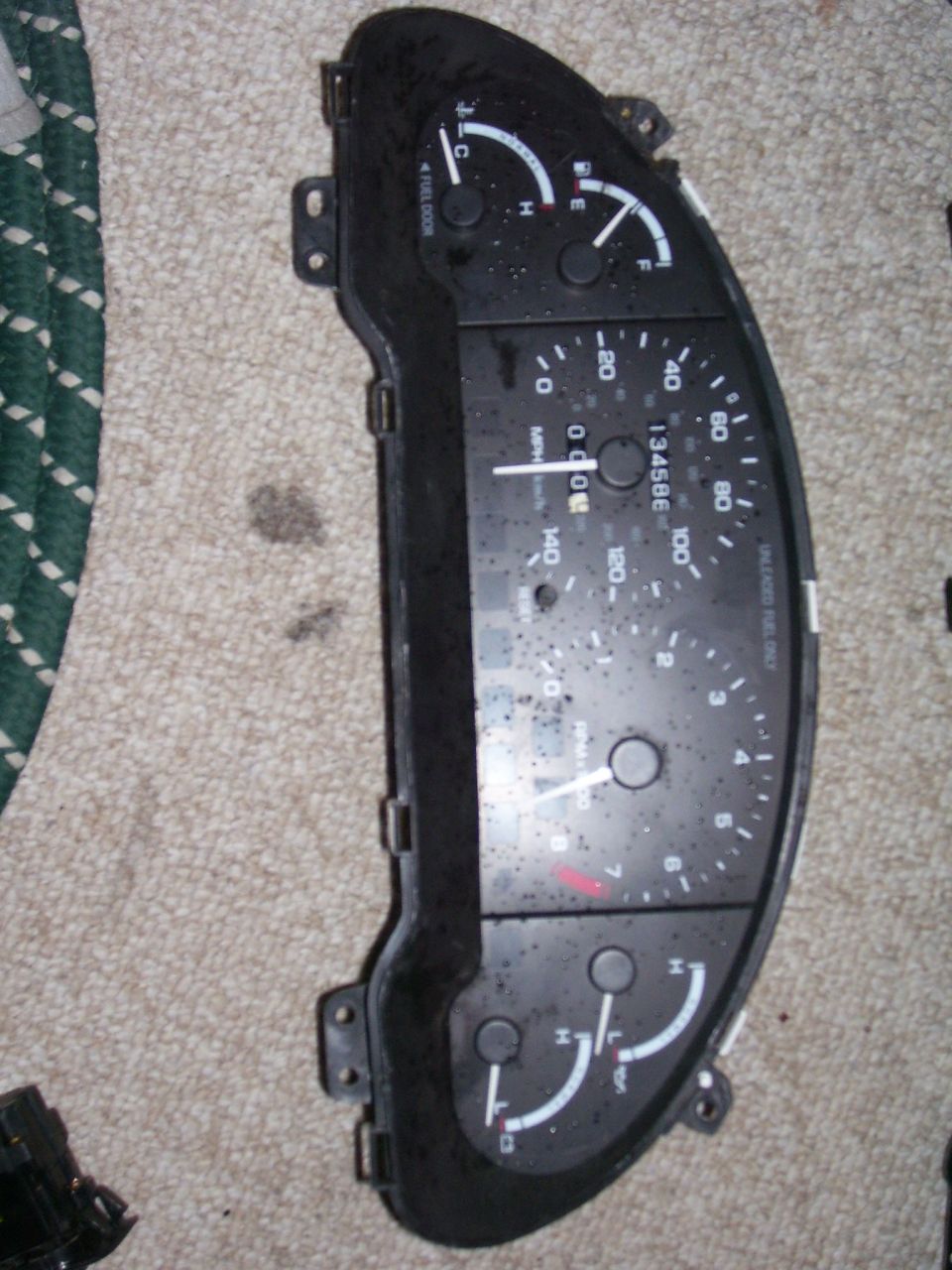Dashboard gauge cluster with speedometer, tachometer, and fuel/temp gauges