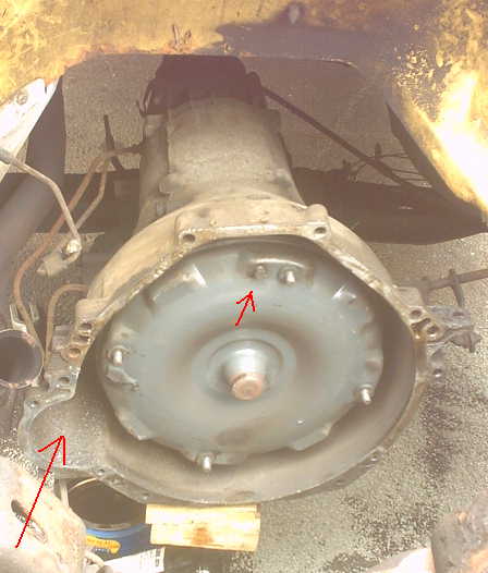 1979 Ford Bronco - Automatic transmission torque converter and bell housing assembly, viewed from the front.