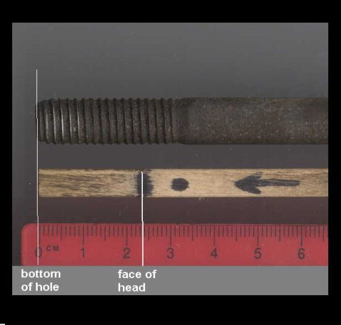 1979 Ford Bronco - A threaded bolt is shown next to a ruler, with markings indicating specific points for measurement.