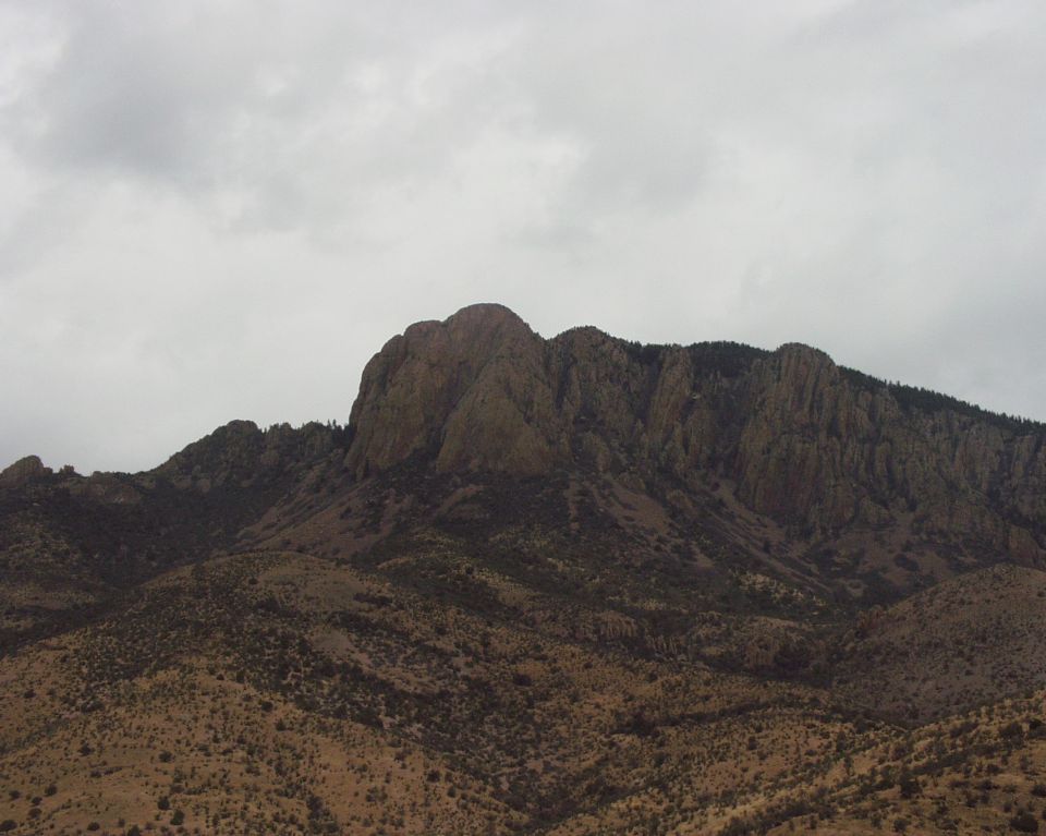 Rocky mountain peak under an overcast sky