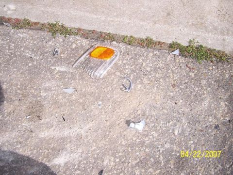 1996 Ford F-350 - Debris from a vehicle accident lies on the ground, with a date stamp of 04/22/2007.