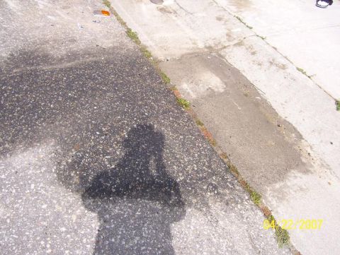 1996 Ford F-350 - Shadow of a photographer on a wet surface, with a date stamp visible in the lower right corner.