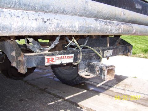 1996 Ford F-350 - Close-up of a trailer hitch assembly, showing wiring and a Redline brand sticker.