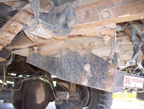 1996 Ford F-350 - Undercarriage view of a 1996 Ford F-350, showing significant rust on suspension components and a Redline hitch.