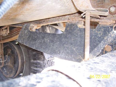 1996 Ford F-350 - Close-up view of the undercarriage of a truck, revealing mechanical components and a tire.