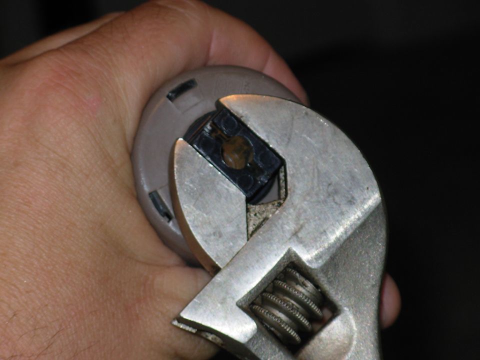 The best place to start disassembly is by removing the colored end caps from the black torque plates.