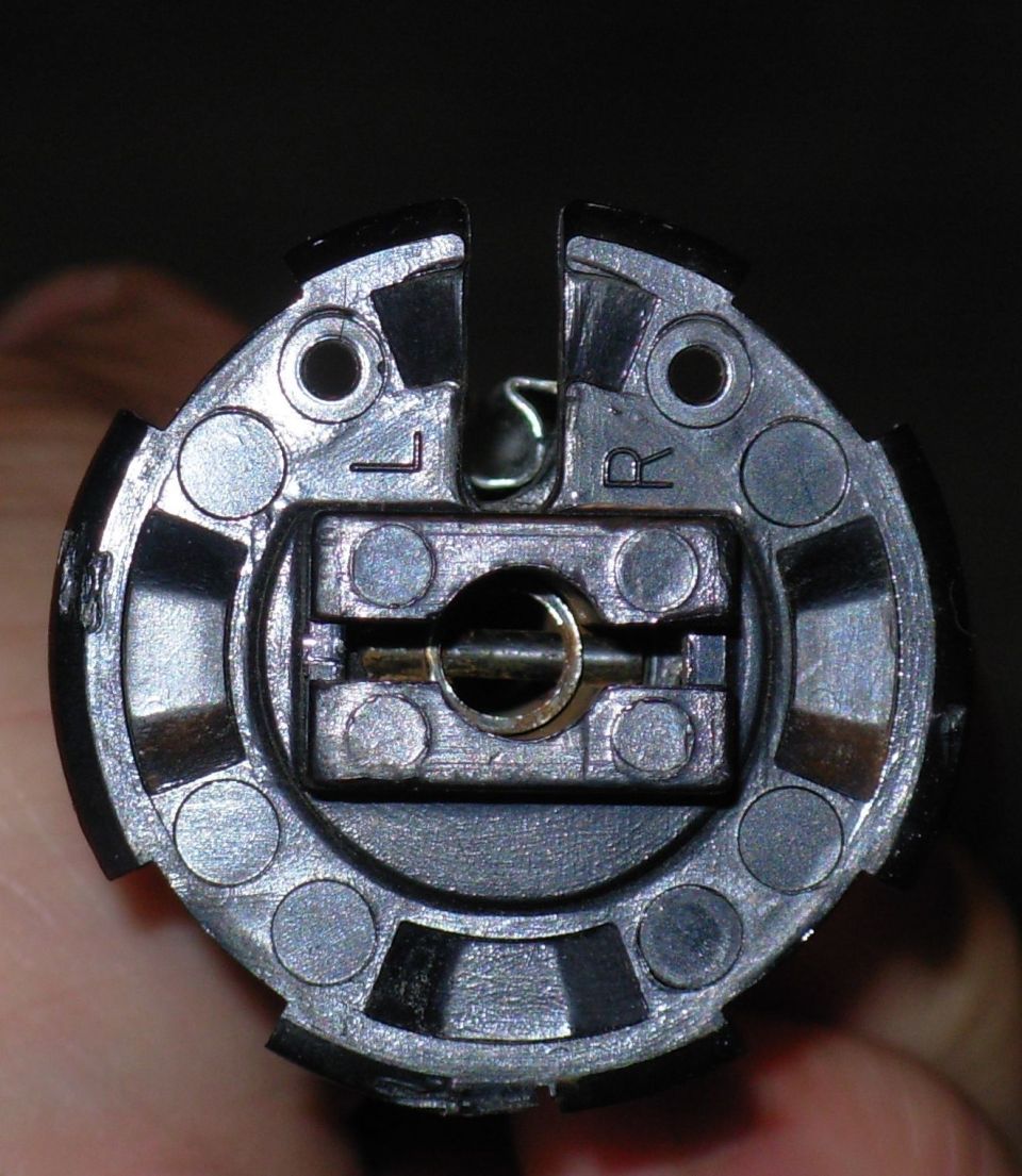 With both end caps off, the cover can be unwrapped.  Align the torque plate slot with the drum slot & slide the cover out.