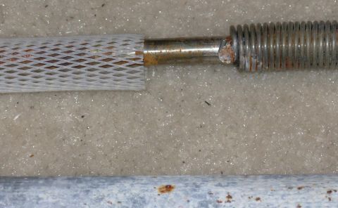 1983 Ford Bronco - The torque spring is riveted to the rod - don't remove it. The rattle-mesh slides off easily.