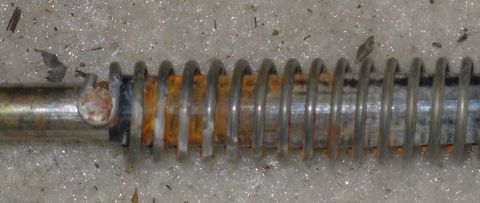 1983 Ford Bronco - There's a black plastic rattle sleeve under the spring that should be captive (NOT removable) under the rivet.