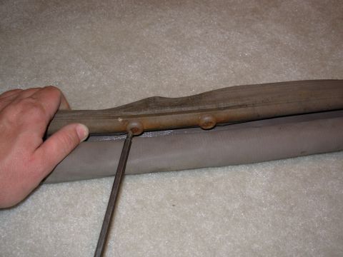 1983 Ford Bronco - Remove the 2 phillips screws from below the handle.
