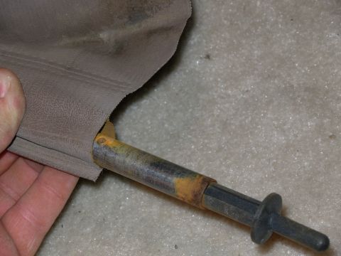 1983 Ford Bronco - Slide the draw rod far enough to expose one rivet, and turn it to the flared end. Use a small file to remove the flare, compress the catch…