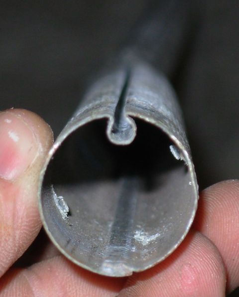 1983 Ford Bronco - Cross-section of the drum tube. There are 6 tabs punched in to locate the white torque rod bearings.